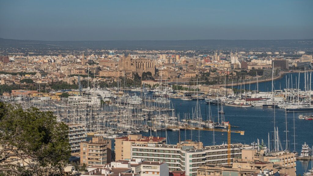 Historic waterfront and moored yachts at golden hour in Palma de Mallorca